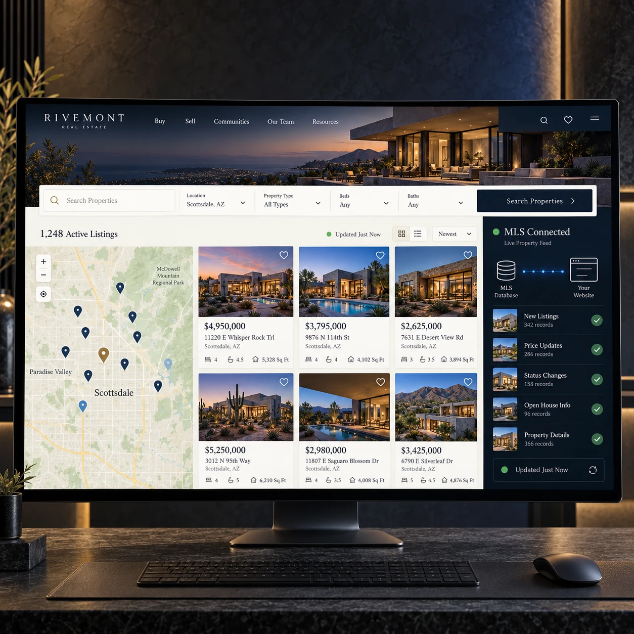 A real estate website showing live MLS listings with map search, property cards and an MLS Connected sync panel, open on a desk monitor